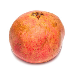 Ripe pomegranate isolated on white.