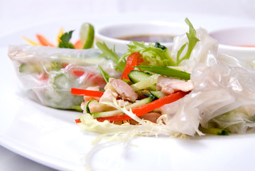 chinese rolls with vegetables on the plate