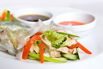chinese rolls with vegetables on the plate