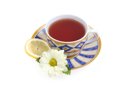 Tea cup, lemon and flower