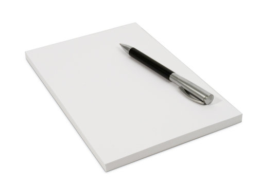 White isolated notpad with a ball pen
