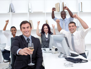 Successful businessteam driking champagne in office