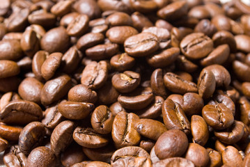 Coffee beans background, close up studio shot.