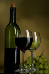 Red wine and grapes