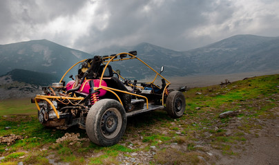 4wd buggy for extreme off-road shot on mountain