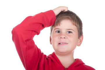 Little boy scratches a head