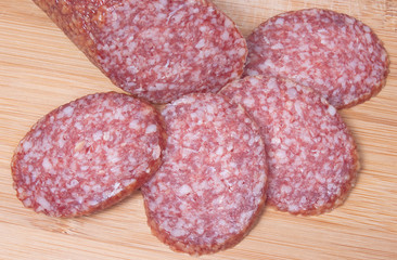 Close up of sliced salami on cutting board