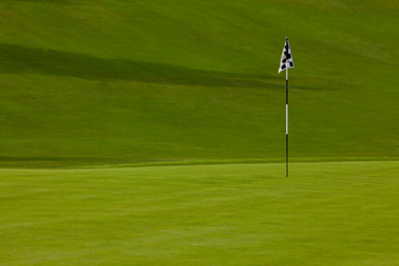 Golf course green with flag