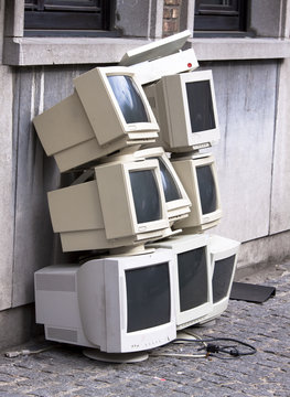 Pile of old discarded crt desktop computer monitors