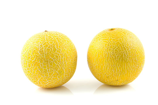 two fresh yellow melon  over white background