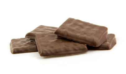 Tasty chocolate candy over white background