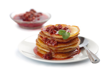 sweet pancakes with strawberry jam isolated