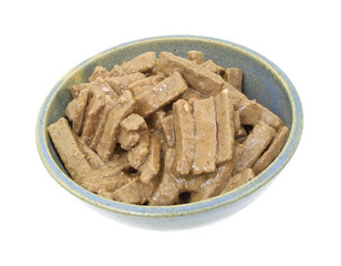 Dog food in a stoneware bowl