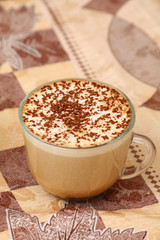 cup of capuccino on table