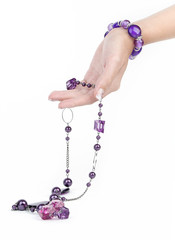 Purple jewlry and bracelet with human hand - 17555601
