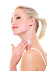 Obraz na płótnie Canvas woman applying moisturizer cream on her neck