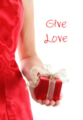 Red gift box in woman's hands