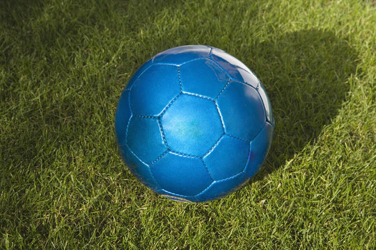 Close up of a Blue leather Football on Grass