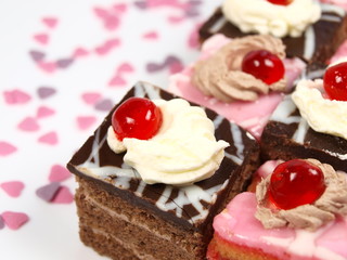 Delicious cakes with chocolate and sweet hearts