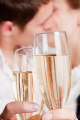 glasses of champagne against lovers