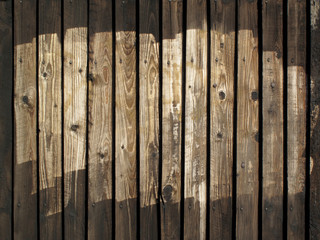 Old wooden half painted brown fence