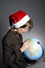 woman with Santa hat planning holiday
