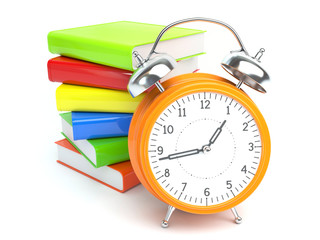 Pile of books and retro clock