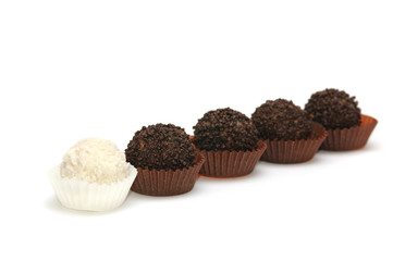 Black and white candies on a white background