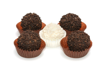 Black and white candies on a white background