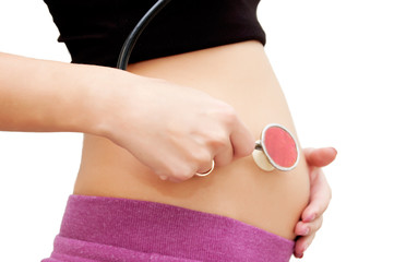 Pregnant woman's belly with stethoscope