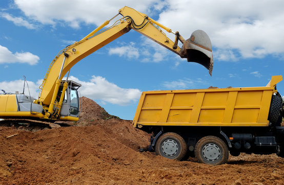 Excavator loading dumper truck
