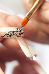 Beauty salon: gluing crystals on nail