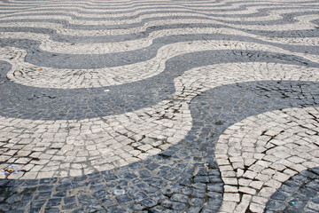 Fototapeta na wymiar Traditional cobblestone old street in Lisbon, Portugal