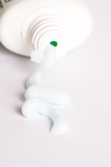Cream spilled from the bottle closeup