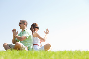 young couple doing meditating