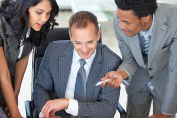 Manager with employees working in office