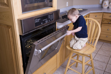 Boy looking in oven