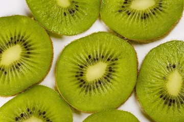 Fototapeta premium Kiwi slices on a white background