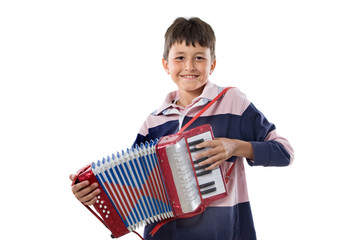Adorable child playing red accordion