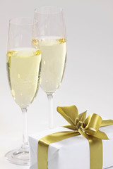 gift and glasses of champagne