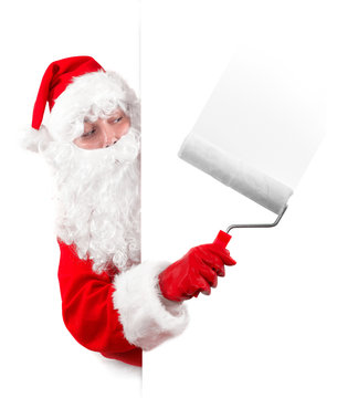 santa claus painting an advertising sign with a roller