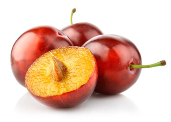 fresh plum fruits isolated on white