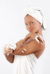 Attractive pleased woman with sponge