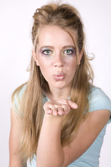 Expression girl blowing a kiss wearing makeup