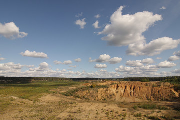 A landscape of plains, rocks and clouds