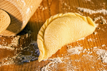 dumplings on the table with flour