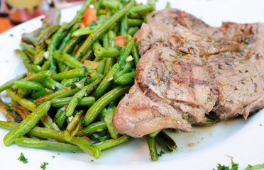 porterhouse juicy steak with fresh green beans