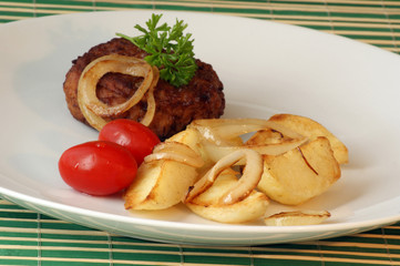 rissole with grilled potato and organic tomato