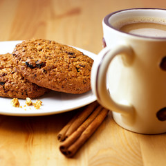 Cinnamon cookies and coffee with milk