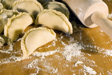 dumplings on the table with flour